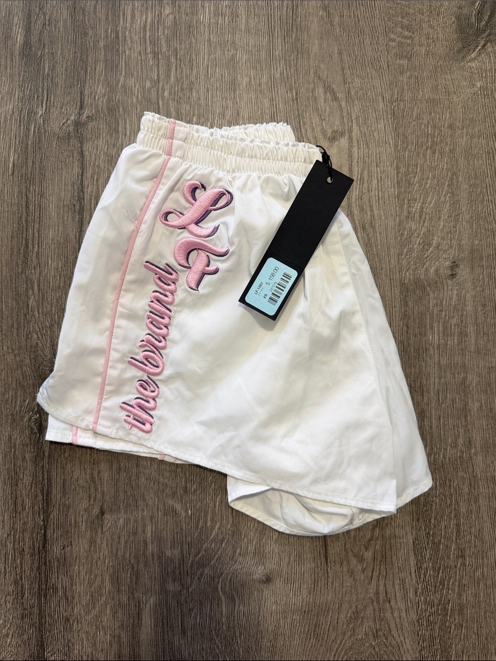 White Athletic Shorts with Pink Trim and Embroidered Logo